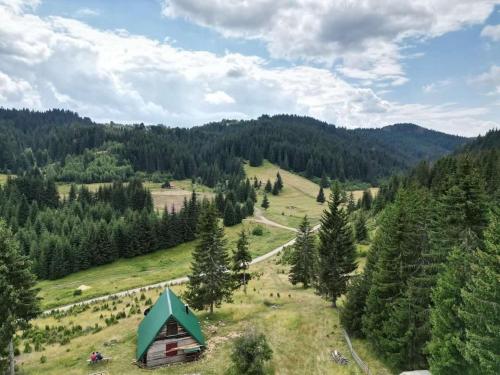 an aerial view of a cabin in the middle of a mountain at Koliba Zlodo in Čajniče