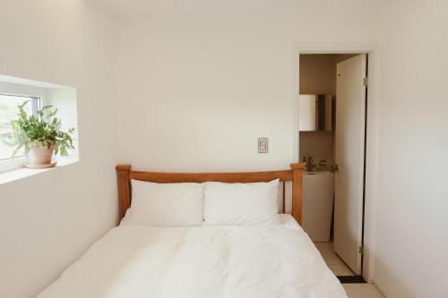 Katil atau katil-katil dalam bilik di Dalthor Pension