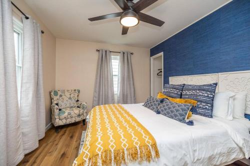 a bedroom with a bed and a ceiling fan at Close to airport* Pets*Fenced yard*A/C & Fast WIFI in Cleveland
