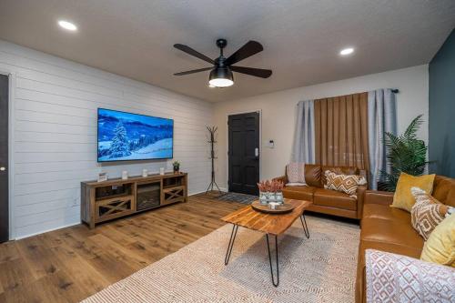 a living room with a couch and a flat screen tv at Close to airport* Pets*Fenced yard*A/C & Fast WIFI in Cleveland