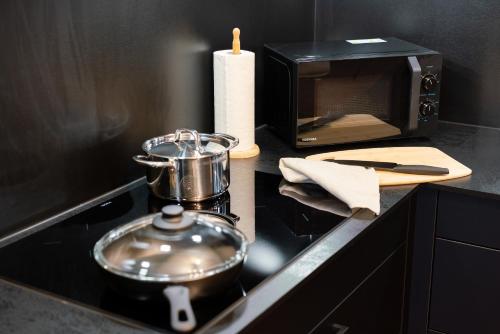 Kuchyň nebo kuchyňský kout v ubytování VOYAGE Stadtoase am Fluss I Zentral I freier Parkplatz I Wifi I Netflix I Aufzug