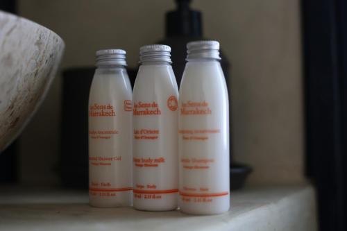 three bottles of milk sitting on a counter at Kasbah des cyprès in Skoura