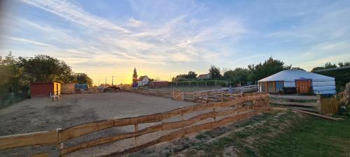 a construction site with a retaining wall and a fence at Jurtarelax in Kozármisleny