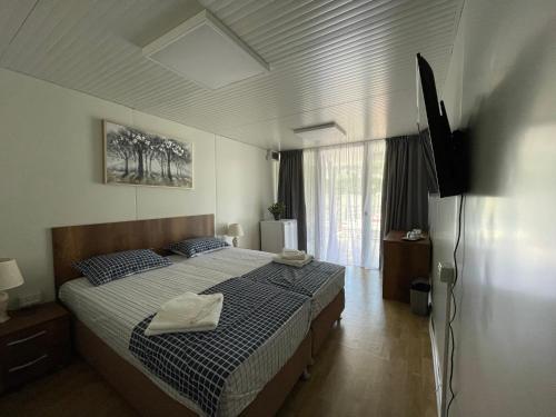 Postel nebo postele na pokoji v ubytování Complex Turistic Emilio