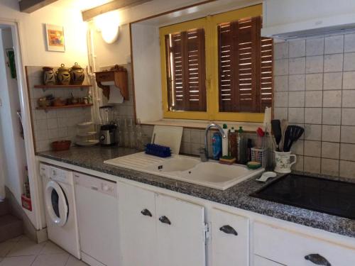 Køkken eller tekøkken på Maison de famille du pont Millénaire