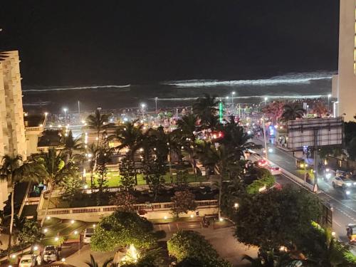 uitzicht op een stad 's nachts met verlichting bij Sea doll 7th floor with Sea view in Visakhapatnam