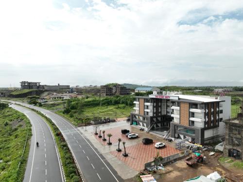an overhead view of a city with a highway at The Scenic Unity in Garudeshwar