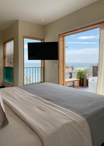Ένα ή περισσότερα κρεβάτια σε δωμάτιο στο Kauhuhu Casa Hotel
