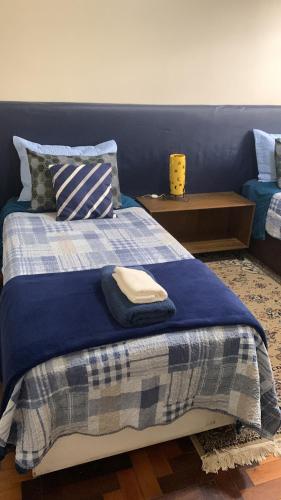 Postel nebo postele na pokoji v ubytování Apto aconchegante com 3 dormitorios bem localizado