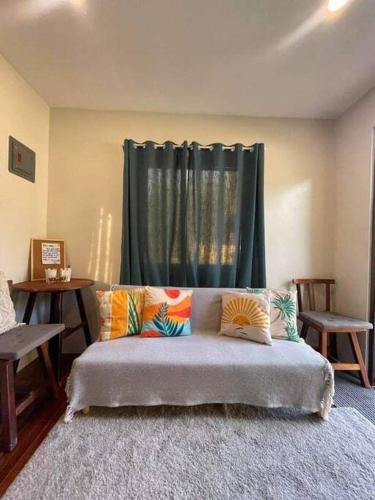 Ein Bett oder Betten in einem Zimmer der Unterkunft Tiny Hideaway Mutya House with free 2 scooters