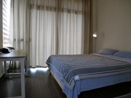 Postel nebo postele na pokoji v ubytování Jome Putrajaya Presint 8 Natural Homestay