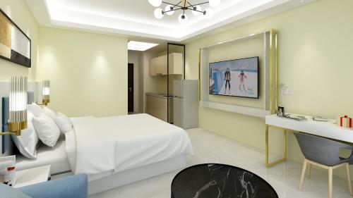 Ένα ή περισσότερα κρεβάτια σε δωμάτιο στο Foshan Laide Apartment