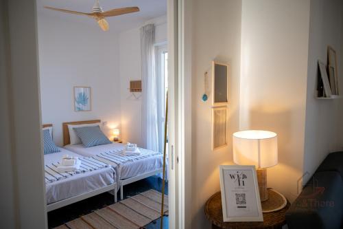 a small room with a bed and a window at [Penthouse with Terrace] • Sea 5Min • Trains 4Min in Varazze