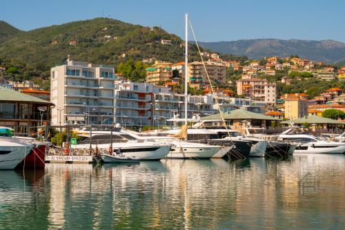 a bunch of boats are docked in a harbor at [Penthouse with Terrace] • Sea 5Min • Trains 4Min in Varazze