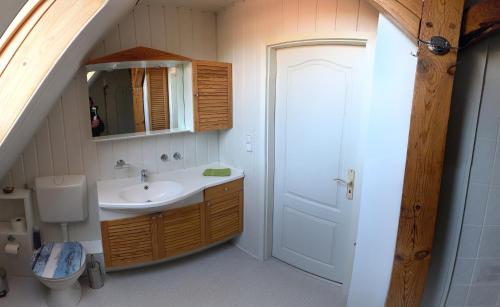 a bathroom with a sink and a toilet at Ferienwohnung Tanja in Lassan