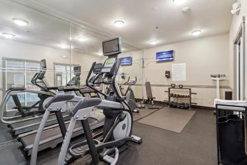 a gym with treadmills and ellipticals in a room at Holiday Inn Hotel & Suites Slidell, an IHG Hotel in Slidell