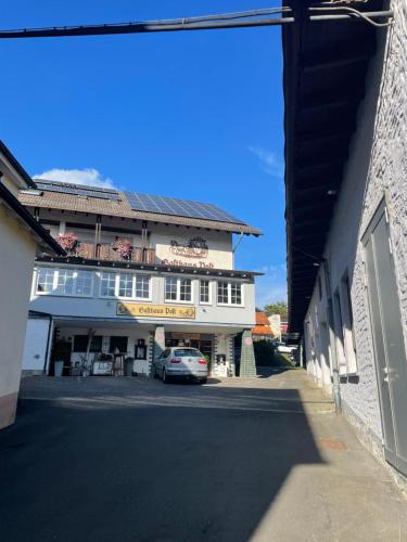 a building with a car parked in front of it at Gasthaus Post in Goldbach