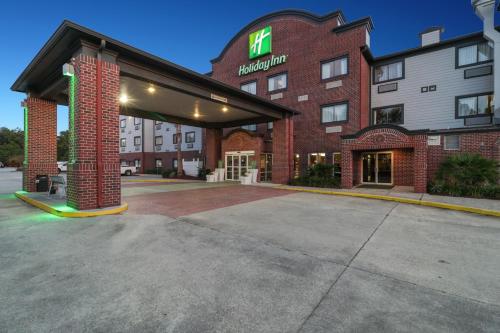 a hotel with a sign on the front of it at Holiday Inn Hotel & Suites Slidell, an IHG Hotel in Slidell