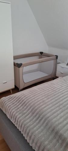 Ein Bett oder Betten in einem Zimmer der Unterkunft Nordlicht