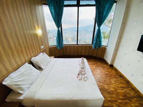 Postel nebo postele na pokoji v ubytování Tulips Resorts - Elkhill