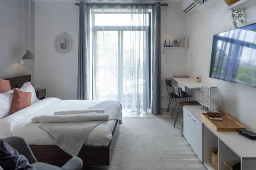Ένα ή περισσότερα κρεβάτια σε δωμάτιο στο Lovely Studio at Embassy Gardens