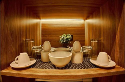 a bathroom with bowls and plates on a counter at Elite Hospitality in Cairo