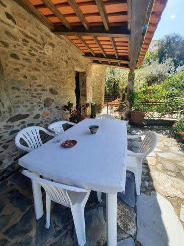 a white table and chairs on a patio at Casa Penafalcão in Castelo Branco