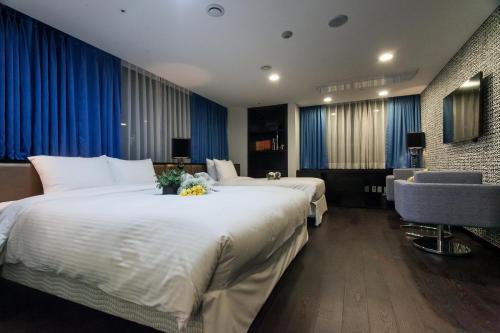 Postel nebo postele na pokoji v ubytování Hotel Pharos