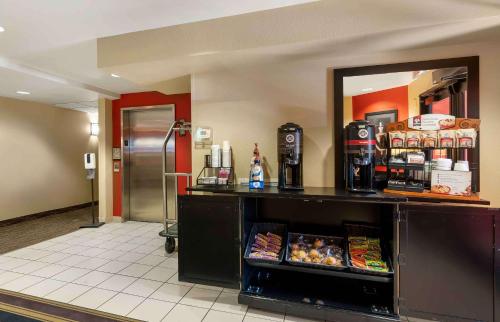 a food counter in a restaurant with a refrigerator at Extended Stay America Suites - Reno - South Meadows in Reno