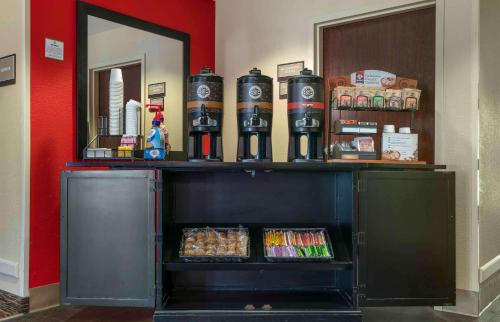 a shelf with a bunch of bottles on top of it at Extended Stay America Suites - Santa Rosa - North in Santa Rosa