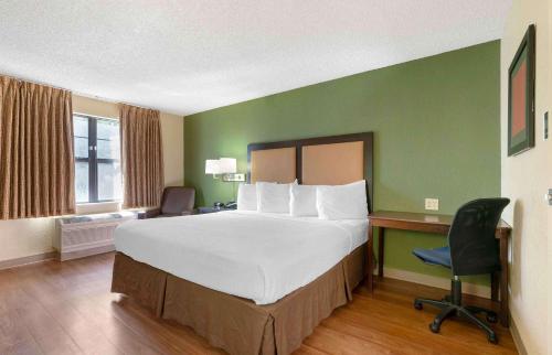 a hotel room with a large bed and a desk at Extended Stay America Suites - Santa Rosa - North in Santa Rosa