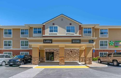 a luxury apartment building with a parking lot at Extended Stay America Suites - San Jose - Edenvale - North in San Jose