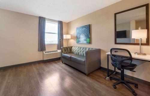 a room with a couch and a desk and a chair at Extended Stay America Suites - San Jose - Edenvale - North in San Jose