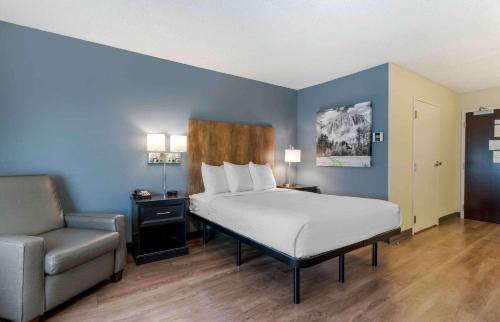a hotel room with a bed and a chair at Extended Stay America Suites - San Ramon - Bishop Ranch - East in San Ramon