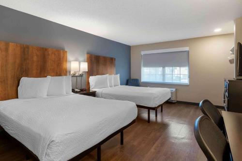 a hotel room with two beds and a window at Extended Stay America Suites - San Ramon - Bishop Ranch - East in San Ramon