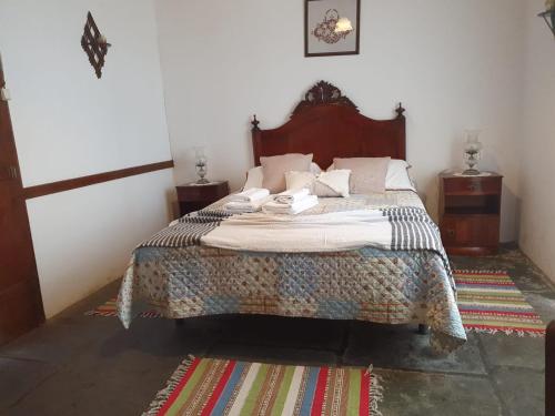 a bedroom with a bed in a room at Casa do Sr. Alberto in Praia da Vitória