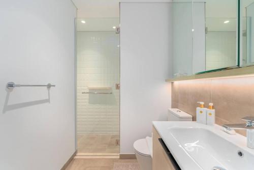 a bathroom with a shower and a sink and a toilet at 1bdr in Belgravia Heights - JVC - Dubai in Dubai