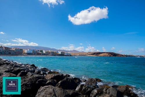 a view of the ocean from a rocky beach at Mara 2 Playa del Burrero junto al mar, wifi gratis in Ingenio