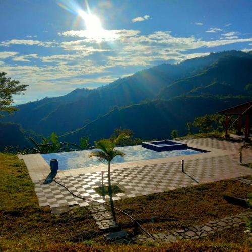 a swimming pool with a view of the mountains at Quinta Maka VistaHermosa in Villeta