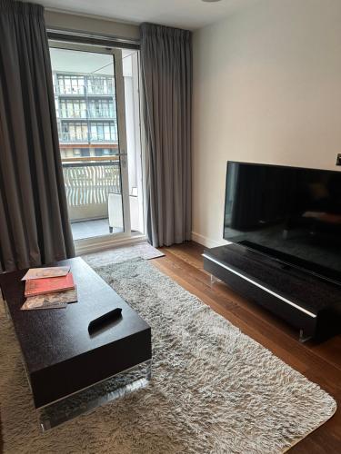a living room with a large flat screen tv at Andrei in London