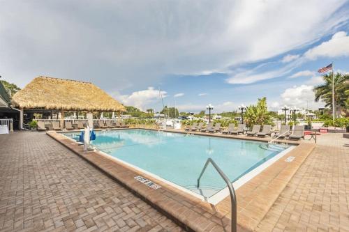 a large swimming pool with lounge chairs and a resort at Bay-Ja Vu in Sarasota