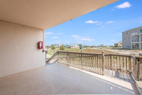 a balcony with a view of the beach at Mayan Princess 101 Beachfront Resort in Port Aransas
