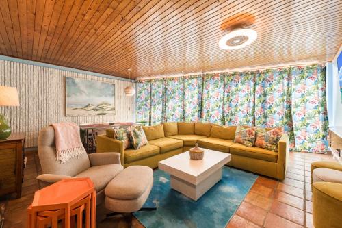 a living room with a couch and a table at Mayan Princess 101 Beachfront Resort in Port Aransas