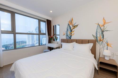 CONDOTEL 5 SAO THE SÓNG VŨNG TÀU Mr VƯƠNG VIP KHÔNG THANH TOÁN TRƯỚCにあるベッド