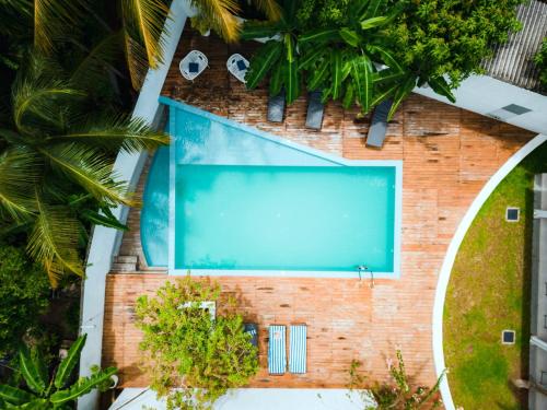 an overhead view of a swimming pool in a resort at Bella Vita in Aluthgama