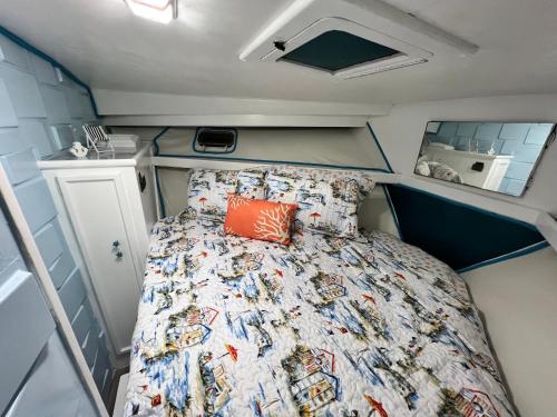 a bed in the back of an rv at Beautiful Floating Stay in Marathon