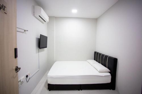 Postel nebo postele na pokoji v ubytování Hom2rex Kuching Homestay Taman Timberland