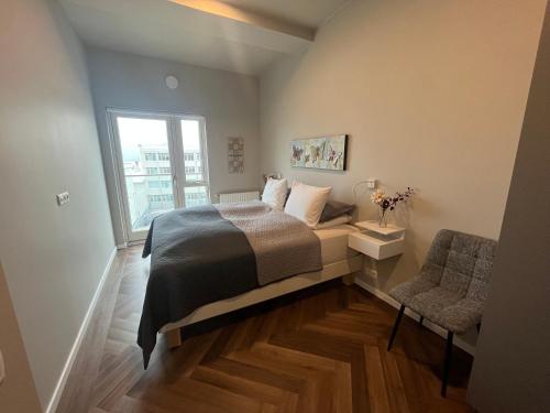 Ένα ή περισσότερα κρεβάτια σε δωμάτιο στο Iceland SJF Apartments - 301