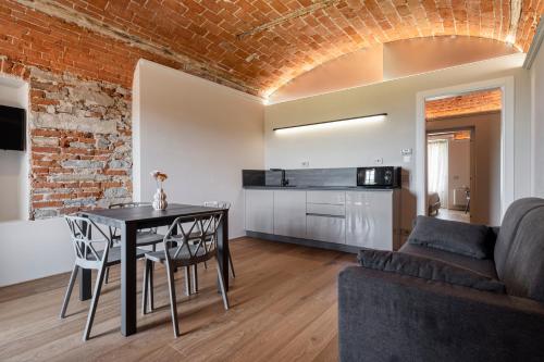 a living room with a table and a couch at Casa Calleri in Briaglia