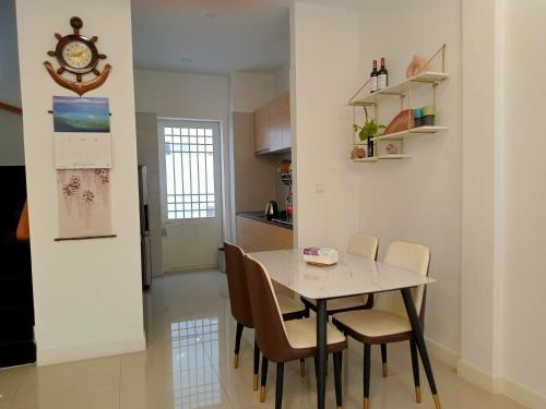 a kitchen and dining room with a table and chairs at C113 Home-1bedroom in Phnom Penh